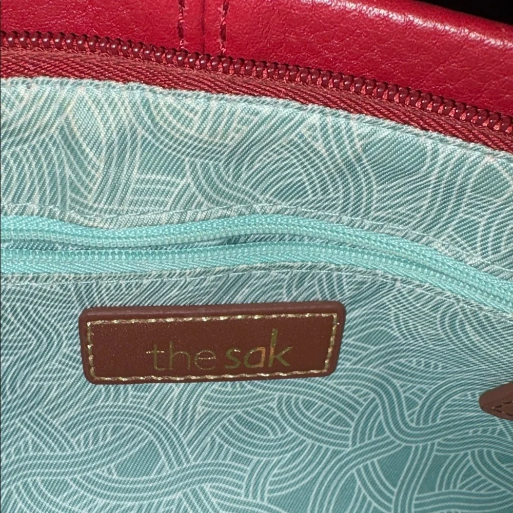 The SAK crossbody bag wristlet clutch. Pebbled Leather red/brown brass HW NWOT
